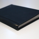 A pocket-sized hard-bound notebook